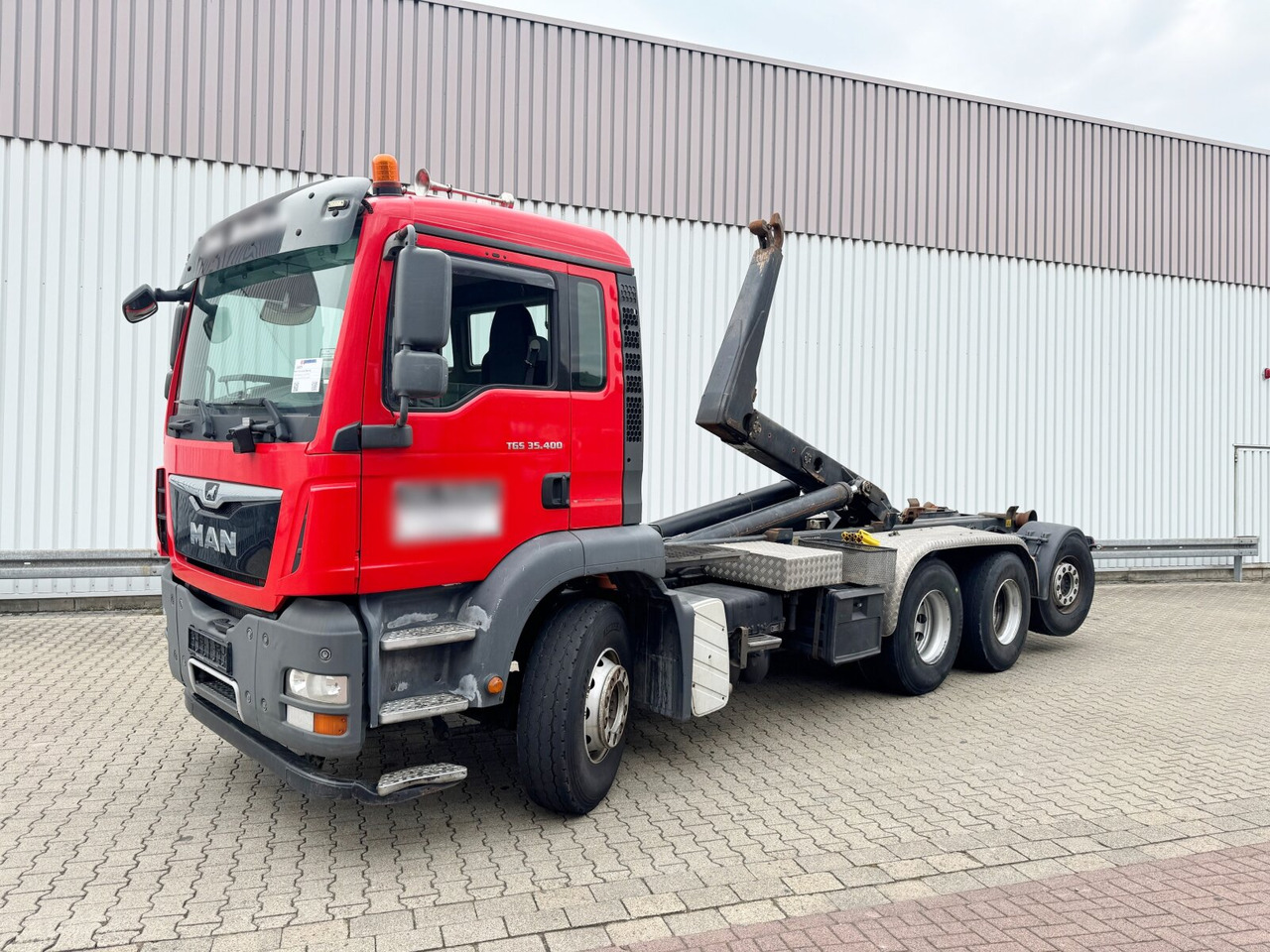 MAN TGA 35.400 8X4-4 BL TGA 35.400 8X4-4 BL, Lenk-/Liftachse - Hook lift truck: picture 1 MAN TGA 35.400 8X4-4 BL TGA 35.400 8X4-4 BL, Lenk-/Liftachse - Hook lift truck: picture 1