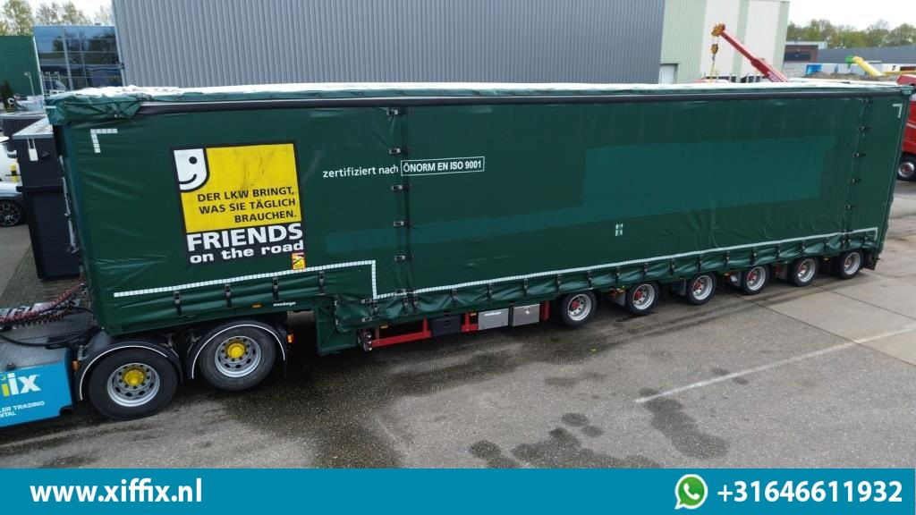 Meusburger 6-ass. Semi dieplader met elektrische huifopbouw / 3x naloop gestuurd - Low loader semi-trailer: picture 1 Meusburger 6-ass. Semi dieplader met elektrische huifopbouw / 3x naloop gestuurd - Low loader semi-trailer: picture 1