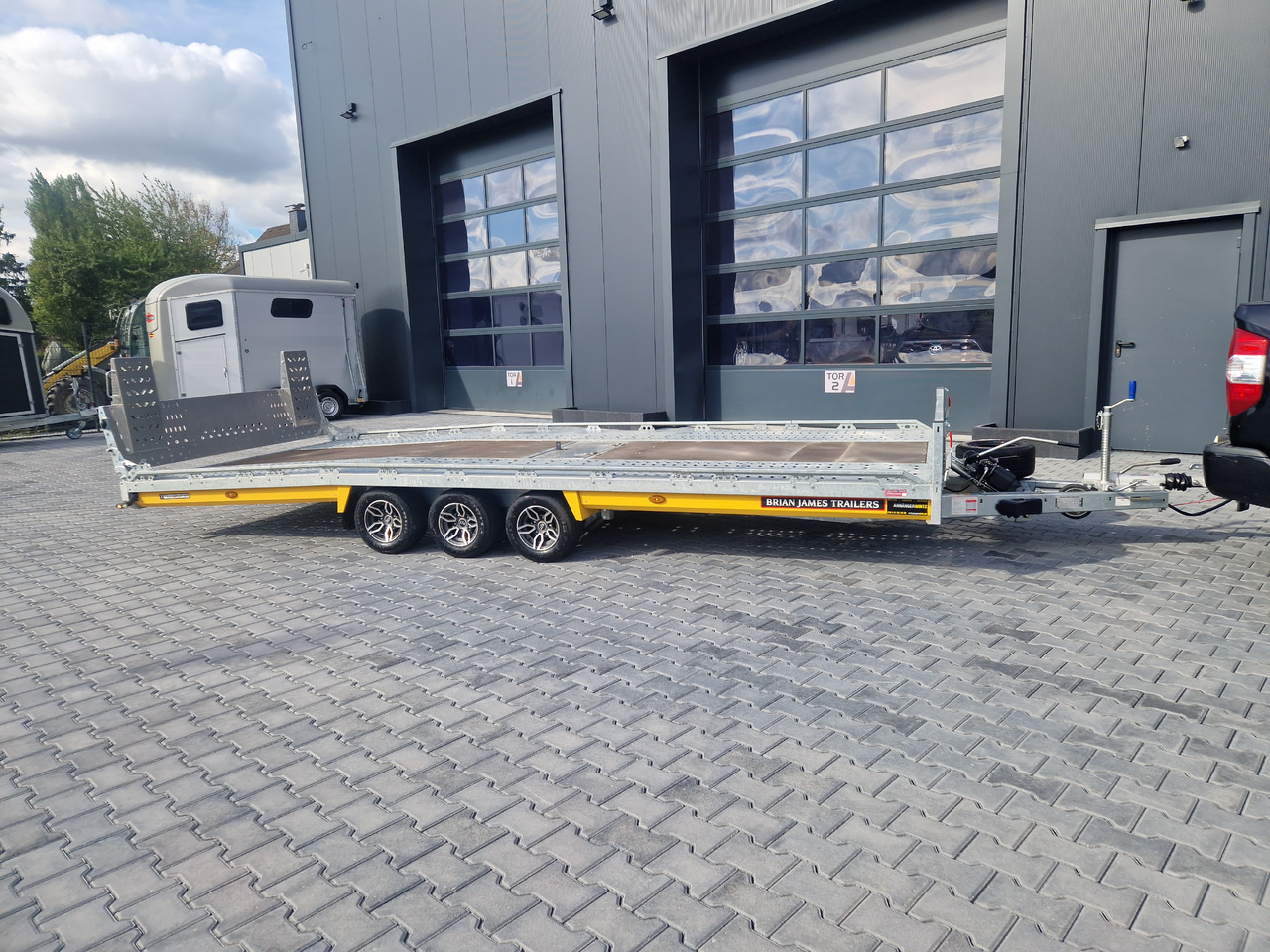 Autotransporter trailer BJT T Transporter 231 550x224cm yellow ankippbar Heckrampe Tridem Alufelgen 10" 3500kg: picture 7 Autotransporter trailer BJT T Transporter 231 550x224cm yellow ankippbar Heckrampe Tridem Alufelgen 10" 3500kg: picture 7