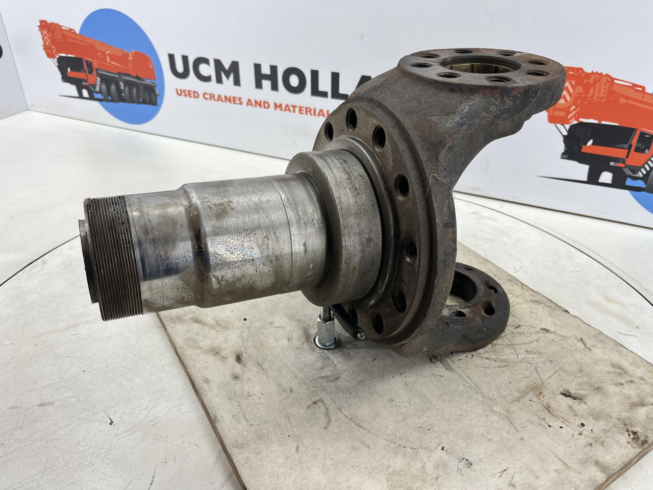 Gottwald Steering knuckle 12 holes axle 3 - Steering knuckle for Mobile crane: picture 1 Gottwald Steering knuckle 12 holes axle 3 - Steering knuckle for Mobile crane: picture 1