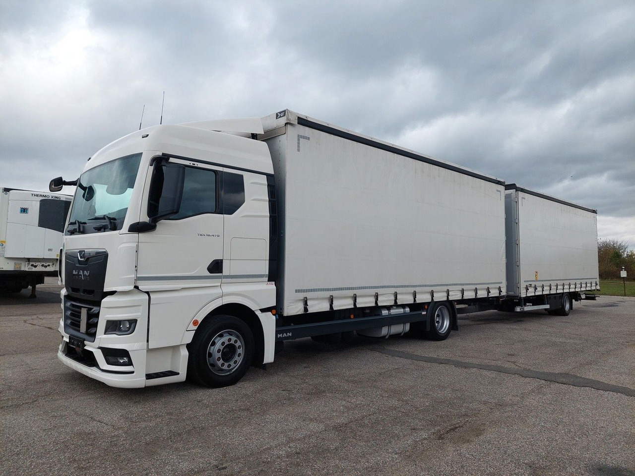 MAN TGX 18.470 LL + Gniotpol G-4080 120 m3 Durchbar - Curtainsider truck: picture 1 MAN TGX 18.470 LL + Gniotpol G-4080 120 m3 Durchbar - Curtainsider truck: picture 1