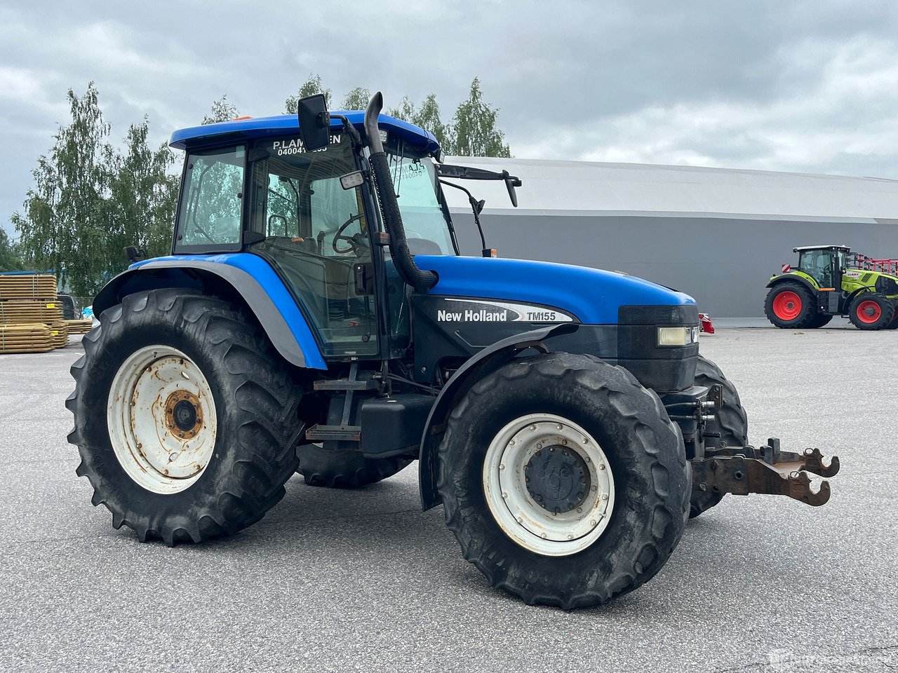 New Holland TM155, traktori etunostolaitteeella, 2004,, Salo - Agricultural machinery: picture 3 New Holland TM155, traktori etunostolaitteeella, 2004,, Salo - Agricultural machinery: picture 3