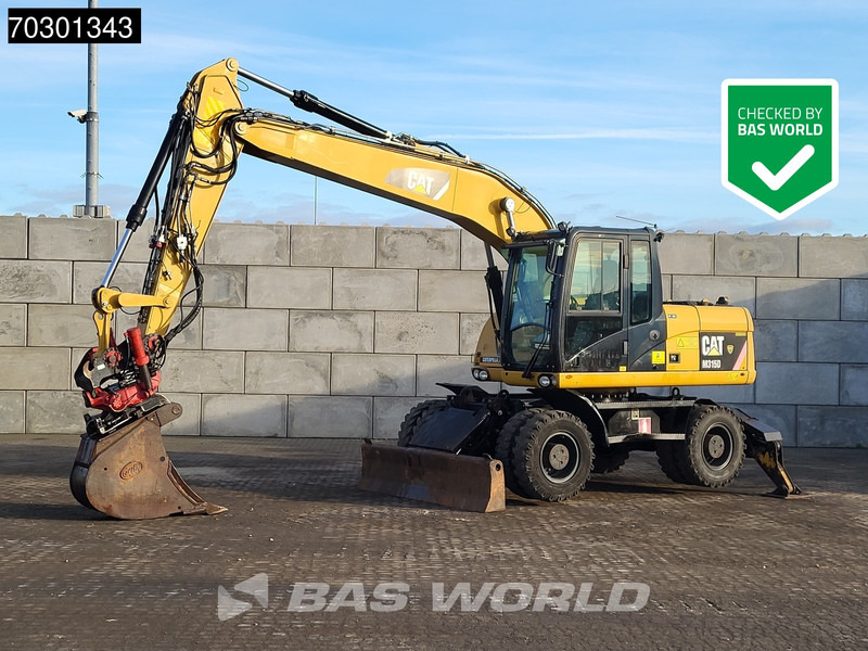Caterpillar M315 D OUTRIGGERS + BLADE - Wheel excavator: picture 1 Caterpillar M315 D OUTRIGGERS + BLADE - Wheel excavator: picture 1